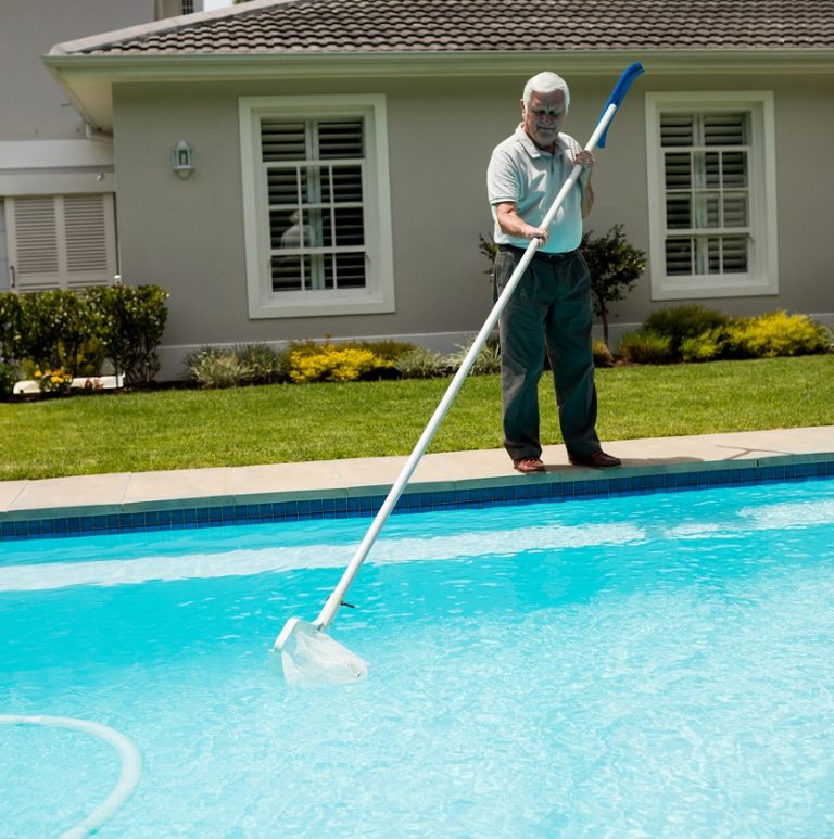 Senior man cleaning swimming pool Pool Service Phoenix